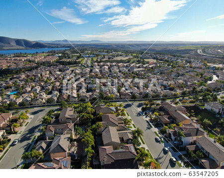 Aerial view of upper middle class neighborhood with identical residential subdivision house 63547205