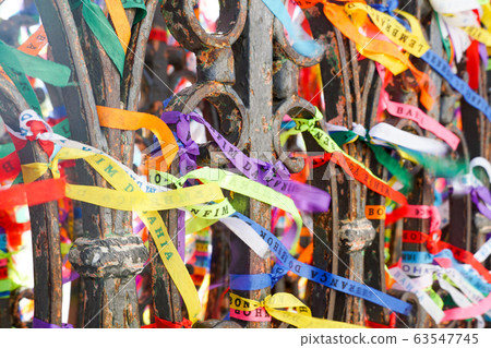 Famous touristic place where people make wishes while tie the ribbons in front of the church. 63547745