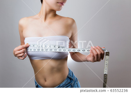 Woman Measuring Bust With A Measure Stock Photo