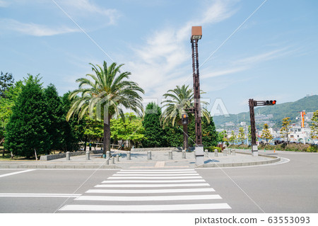 Crosswalk and palm trees in Nagasaki, Japan Crosswalk and palm trees in Nagasaki, Japan 63553093