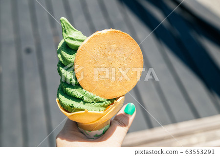 Green tea soft ice cream cone in Yufuin, Japan 63553291
