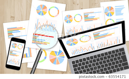 Laptop, smartphone, magnifying glass set with graph material displayed on monitor Wood grain desk overhead view 63554171