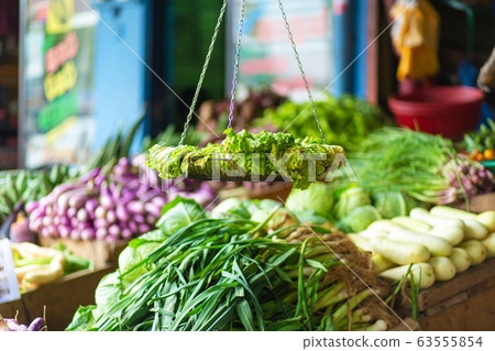 Rotten leaf lettuce on a display stand of a Rotten leaf lettuce on a display stand of a 63555854