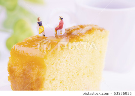 Two women arriving at the table with pineapple cake Two women arriving at the table with pineapple cake 63556935