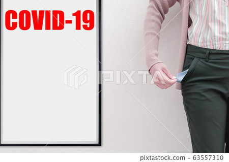 text COVID-19 on wood frame with woman showing her text COVID-19 on wood frame with woman showing her 63557310