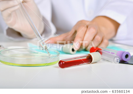 Blood examination testing in hospital laboratory. 63560134