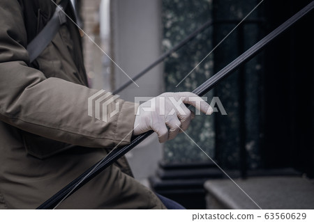 Man hand in plastic glove virus protection 63560629