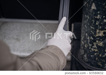 Man hand in plastic glove virus protection 63560632