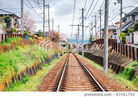 Railway and kyoto old town with cherry blossoms in Kyoto, Japan Railway and kyoto old town with cherry blossoms in Kyoto, Japan 63561793