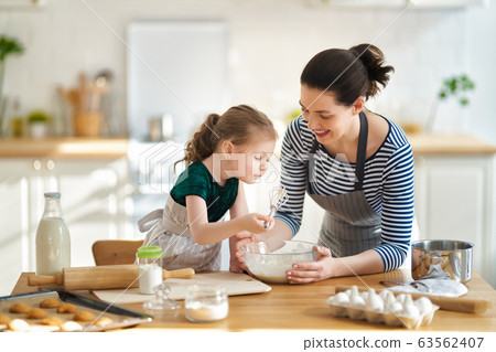 family are preparing bakery together family are preparing bakery together 63562407