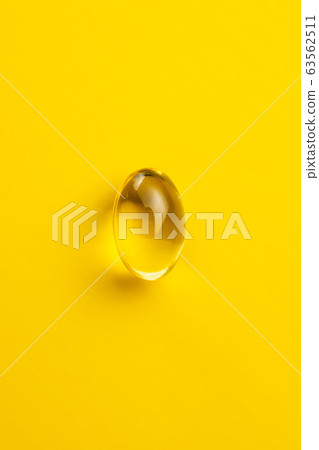 Omega 3 pills. Fish oil supplement capsules 63562511