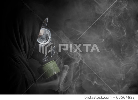 Man in a gas mask in the smoke Man in a gas mask in the smoke 63564652
