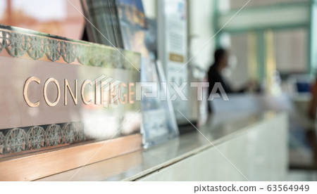Concierge service counter of hotel, restaurant or apartment's front desk in luxury reception hall in Thailand with staff working for serving tourist guest or check-in customers Concierge service counter of hotel, restaurant or apartment's front desk in luxury reception hall in Thailand with staff working for serving tourist guest or check-in customers 63564949