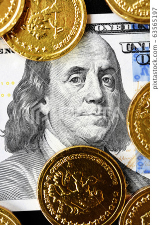close up of gold coins on banknote close up of gold coins on banknote 63565197