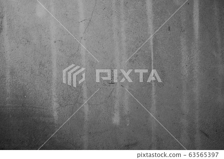 Close-up of White cement crack wall and peeled paint caused by water and sunlight. Peel wall of White house paint with black stain. Black and White of Texture background. Close-up of White cement crack wall and peeled paint caused by water and sunlight. Peel wall of White house paint with black stain. Black and White of Texture background. 63565397