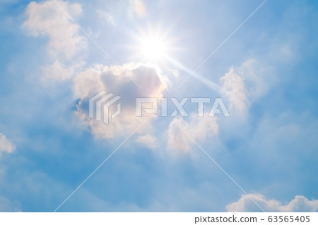 Beautiful fluffy white clouds with blue sky, Sun and Sunlight, Nature background. 63565405