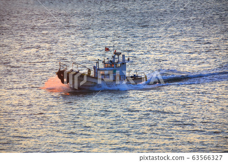 Fishing boat launching from Dadaepo dock to island Fishing boat launching from Dadaepo dock to island 63566327