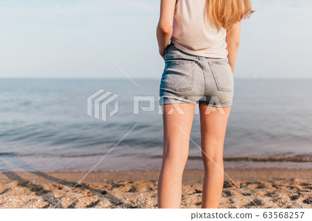 Back photo, close-up of a woman's leg standing on Back photo, close-up of a woman's leg standing on 63568257