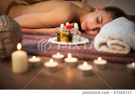 Relax and enjoy in spa salon, getting massage by 63568331