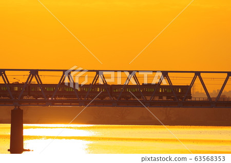 Keio Line passing the morning glow and Tamagawa Bridge 63568353