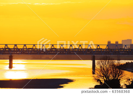 Keio Line passing the morning glow and Tamagawa Bridge 63568368