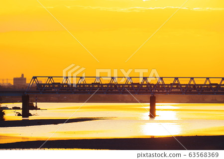 Keio Line passing the morning glow and Tamagawa Bridge 63568369
