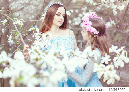 Tender portrait of mom and daughter among 63568951