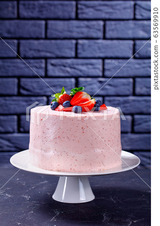 a whole pink strawberry cake on a cake stand a whole pink strawberry cake on a cake stand 63569910