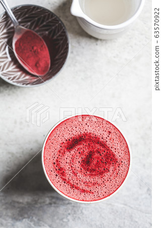 Pink beetroot latte with milk and beetroot powder 63570922