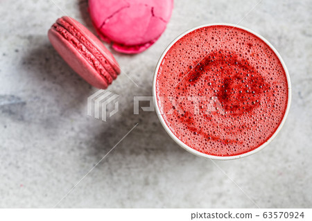 Pink beetroot latte in a ceramic glass, top view. Pink beetroot latte in a ceramic glass, top view. 63570924
