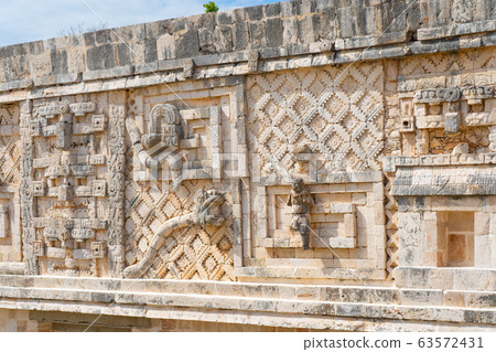 Fragment of the Governor's Palace (Nunnery Quadrangle). Uxmal an ancient Maya city of the classical period. Travel photo. Yucatan. Fragment of the Governor's Palace (Nunnery Quadrangle). Uxmal an ancient Maya city of the classical period. Travel photo. Yucatan. 63572431
