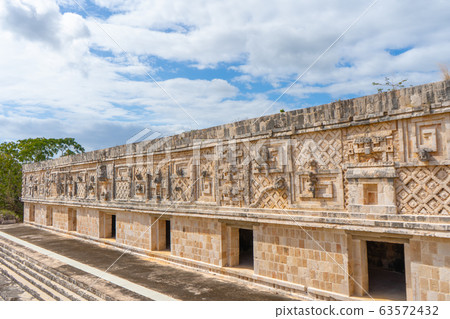 Fragment of the Governor's Palace (Nunnery Quadrangle). Uxmal an ancient Maya city of the classical period. Travel photo. Yucatan. Fragment of the Governor's Palace (Nunnery Quadrangle). Uxmal an ancient Maya city of the classical period. Travel photo. Yucatan. 63572432