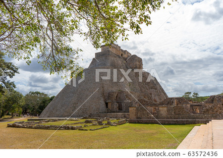 The Adivino (the Pyramid of the Magician or the Pyramid of the Dwarf). Uxmal an ancient Maya city of the classical period. Travel photo. Yucatan. 63572436