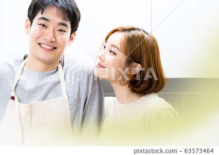 Newlyweds cooking kitchen Newlyweds cooking kitchen 63573464