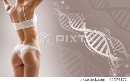 Sporty female body near DNA stems. Over beige background. Sporty female body near DNA stems. Over beige background. 63574172