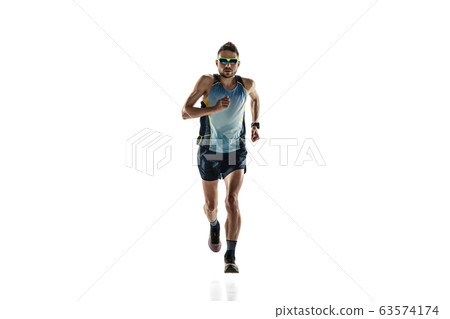 Triathlon male athlete running isolated on white studio background Triathlon male athlete running isolated on white studio background 63574174