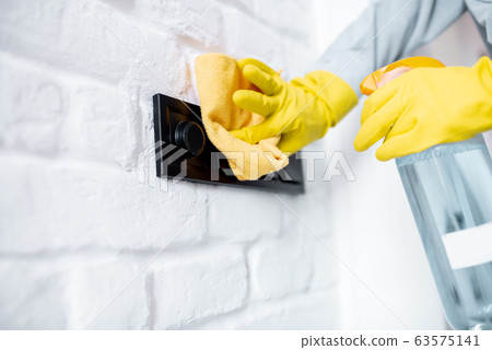 Woman cleaning stair railings at home Woman cleaning stair railings at home 63575141