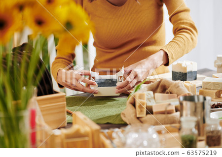 Woman packing fragrant soap Woman packing fragrant soap 63575219