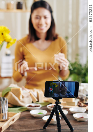 Woman recording video about soap making 63575231