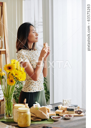 Woman smelling handmade soap Woman smelling handmade soap 63575263