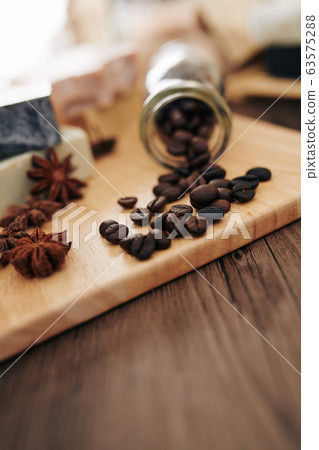 Coffee beans and anise flowers 63575288
