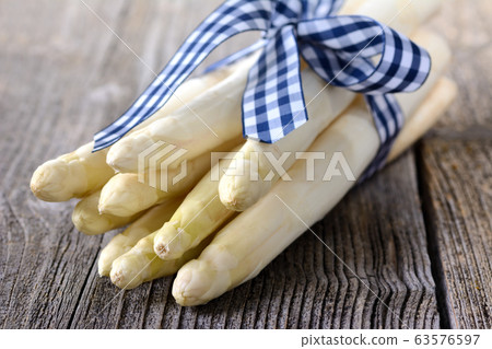 White asparagus from Germany on a wooden table White asparagus from Germany on a wooden table 63576597