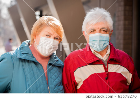 Portrait of an elderly couple in protective masks Portrait of an elderly couple in protective masks 63578270