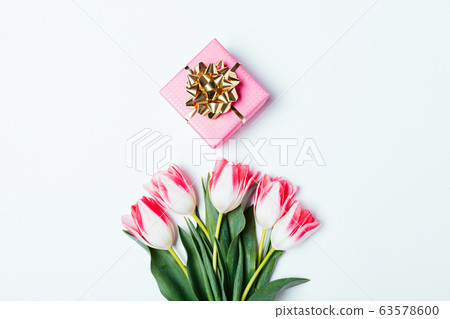 Small gift box and bunch of delicate fresh pink 63578600
