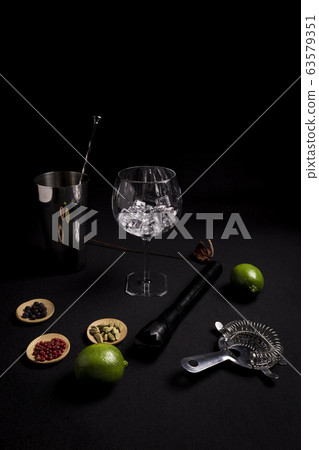 cocktail of gin and tonic on a black background cocktail of gin and tonic on a black background 63579351