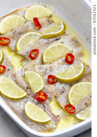 baked cod fish with lemon and chilli 63581421