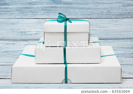 Group of gift boxes over wood background with copy space Group of gift boxes over wood background with copy space 63581604
