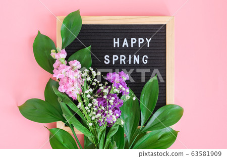 Happy Spring text on black letter board and 63581909