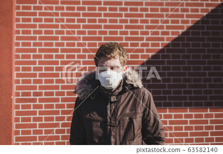 Caucasian man in medical mask Caucasian man in medical mask 63582140