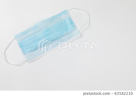 blue surgical medical mask on white background 63582210